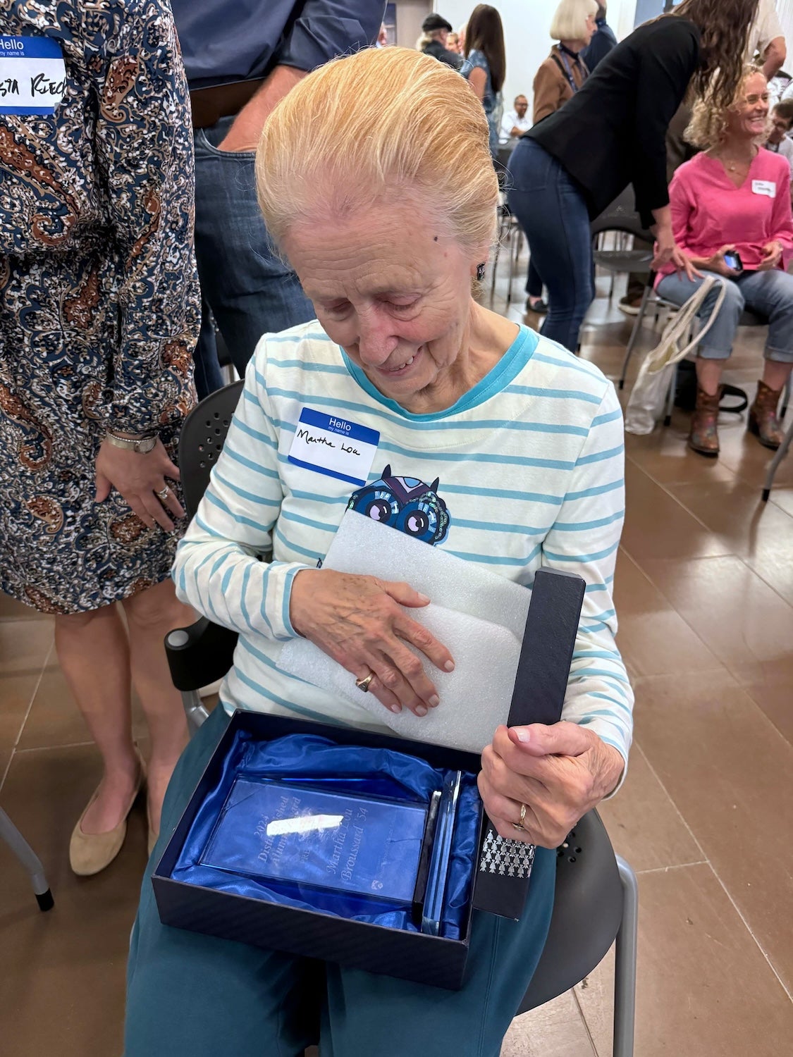 Martha Lou Broussard looks at her Distinguished Alumni award