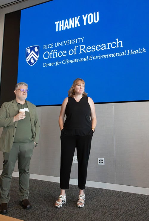 Image of CCEH directors in front of a projector screen
