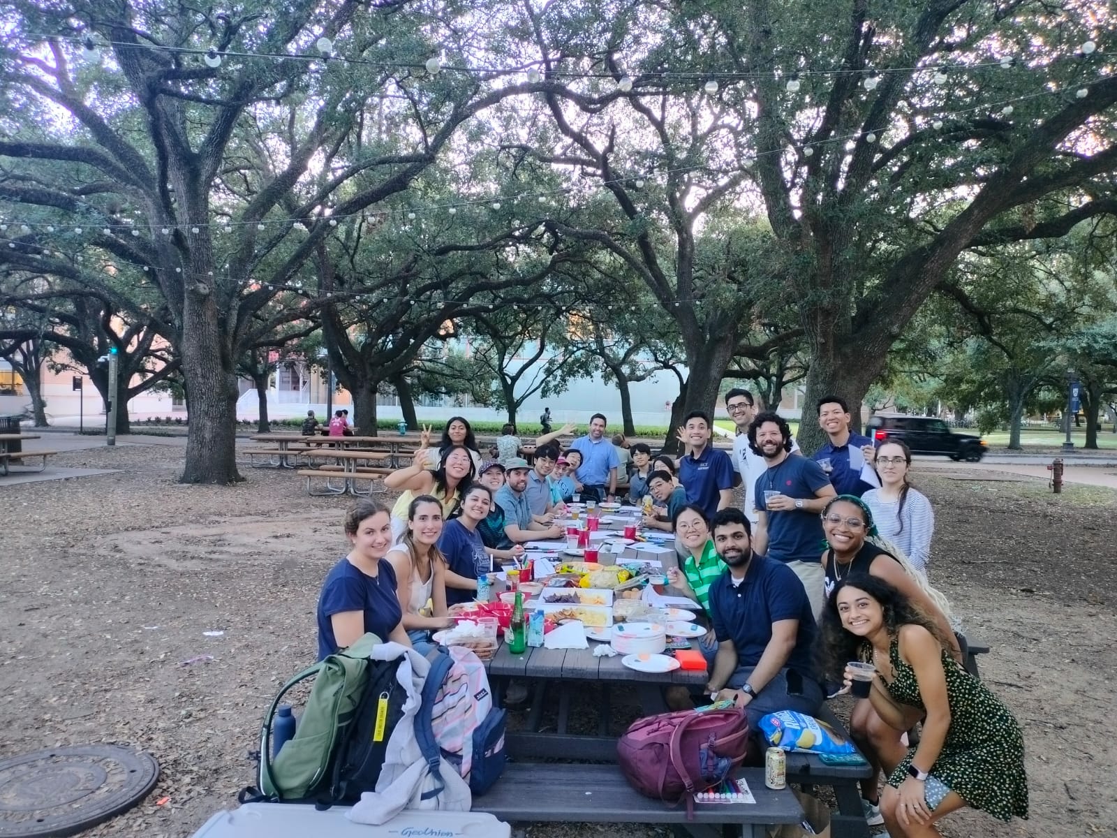 Picture of EEPS graduate students at picnic table during welcome event