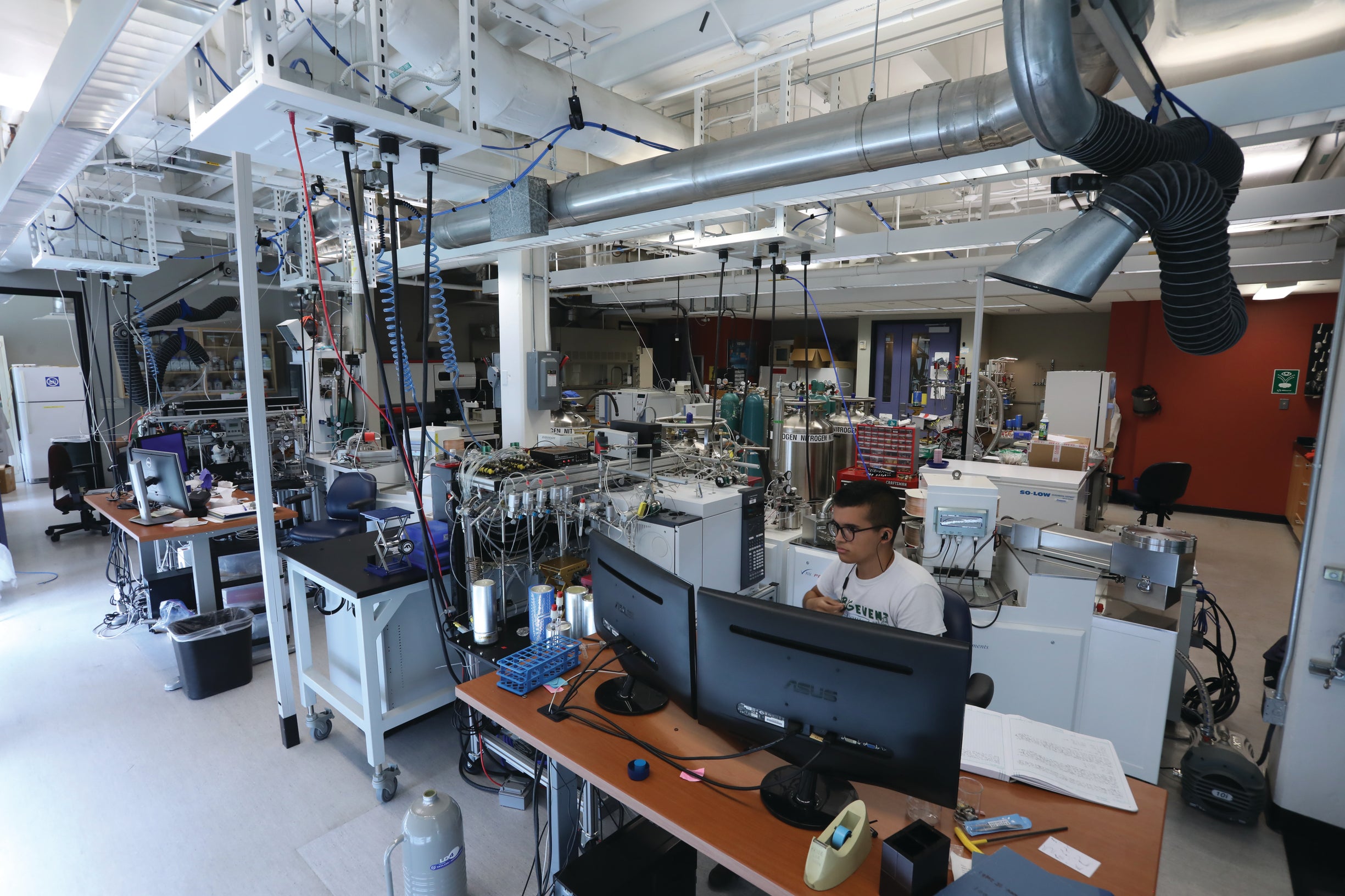 Photography from above looking at a large open room with scientific instruments