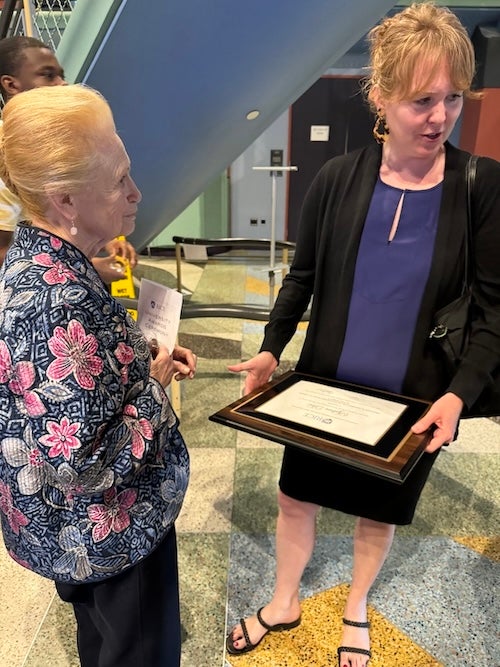 Martha Lou Broussard ('57), EEPS first female graduate, with Dr. Sylvia Dee at the CTE awards ceremony.  Sylvia holds her certificate for the Provost's Award for Outstanding Early-Career Faculty Achievement.