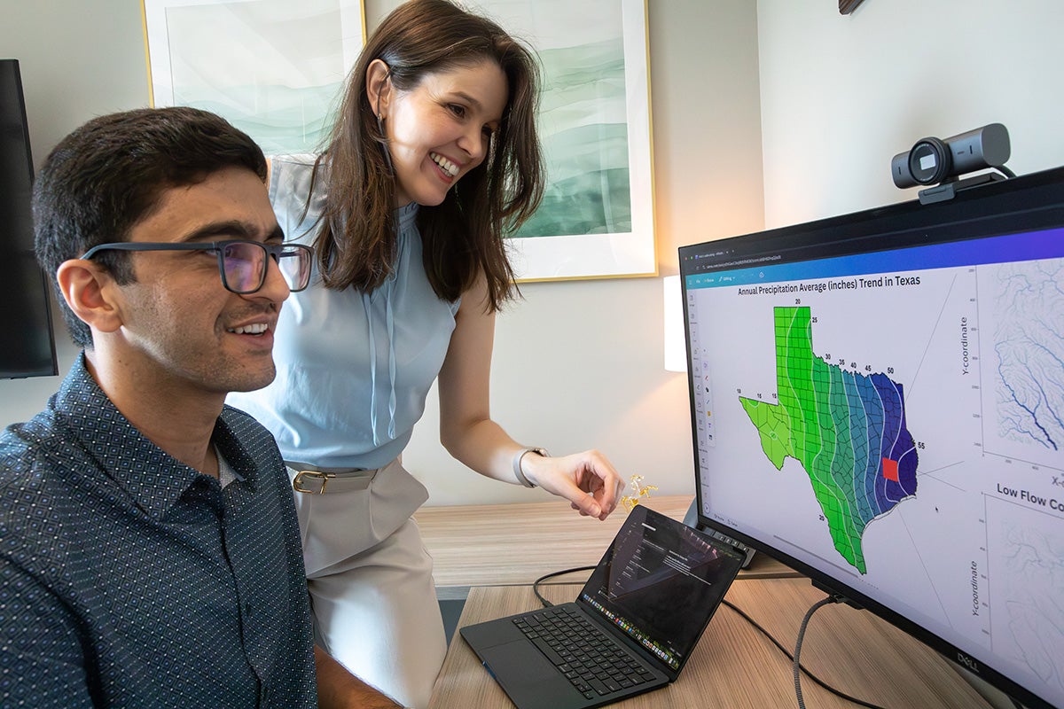 Adnan Dehghani and Noemi Vergopolan reveiw soil moisture data on monitor