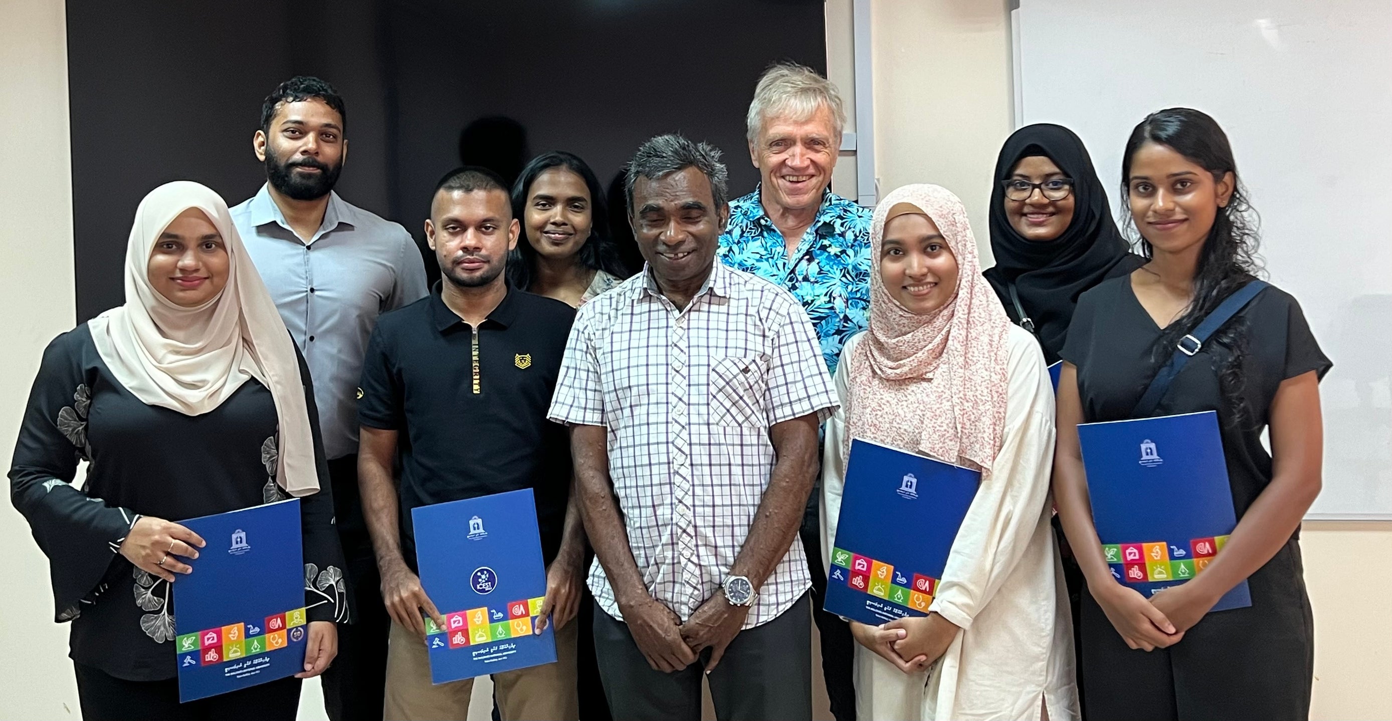December 2023 graduation ceremony with some of the students who were enrolled in my courses at the Maldives National University. Center: Mr. Adam Khalid, Dean of Faculty of Engineering, Science and Technology (FEST) at MNU. Photo AW Droxler