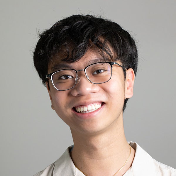 Photo of Andy Ngu on a gray background