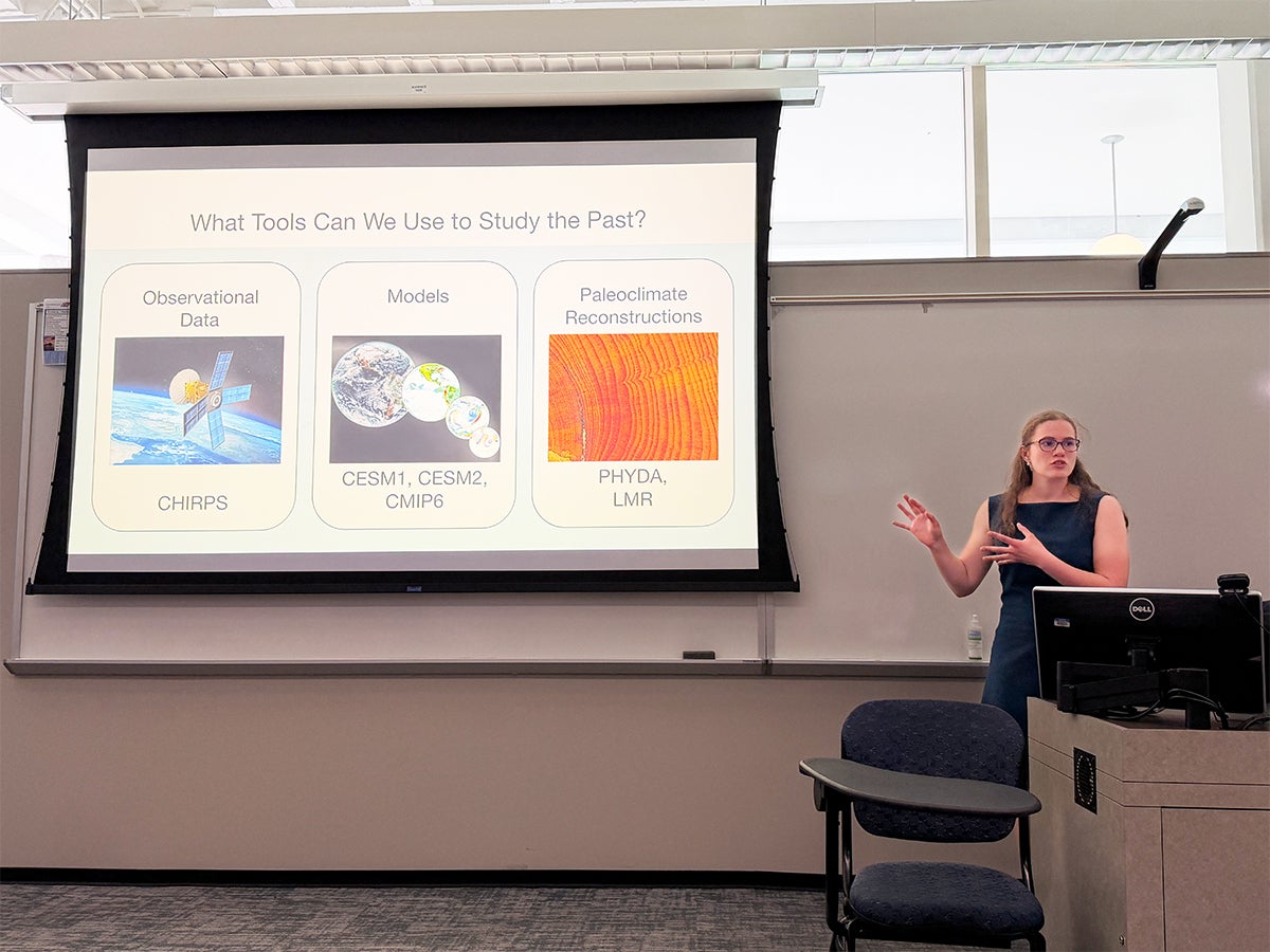 Photo of Nylan Hartigan giving a presentation at Rice University