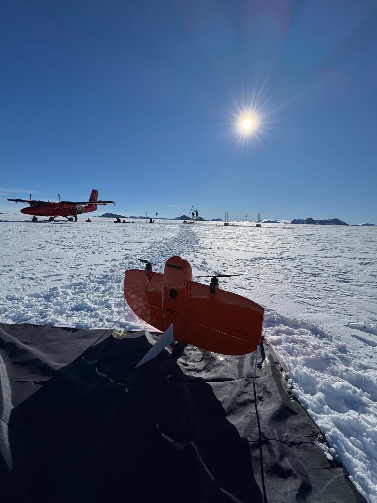 Image of a twin otter plane and research drone at Flask Glacier in Antarctica. 