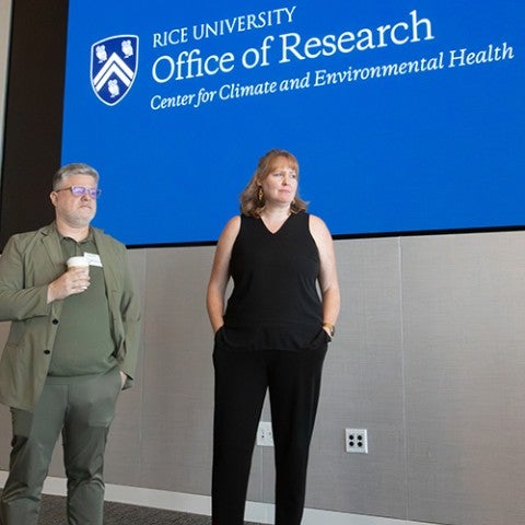Image of CCEH directors in front of a projector screen